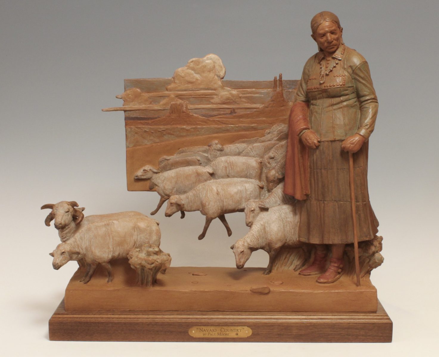 Bronze sculpture of Navajo woman herding sheep by Paul Moore
